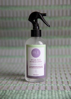 bottle of lavender mint Refresh Spray on sage Ritual Rug